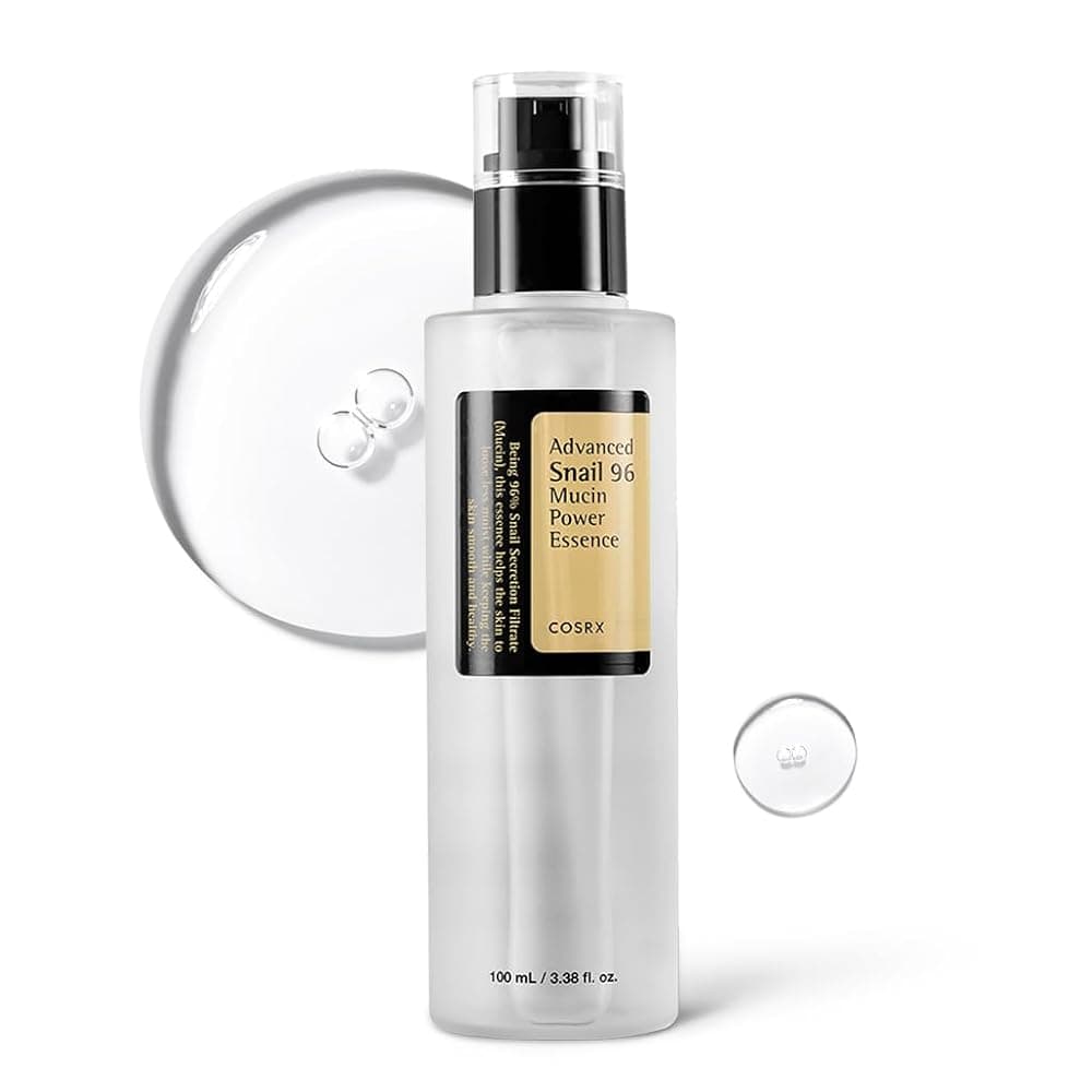 COSRX Advanced Snail 96 essence bottle on warm stone