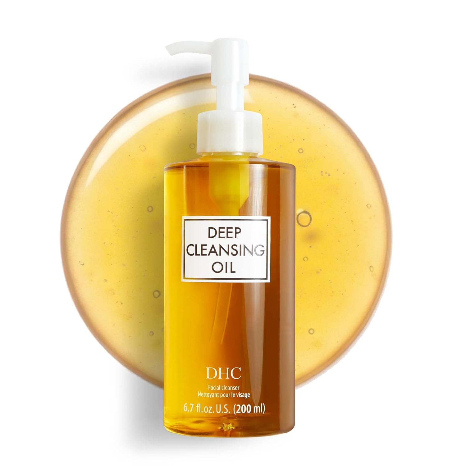 DHC Deep Cleansing Oil bottle in soft daylight on linen